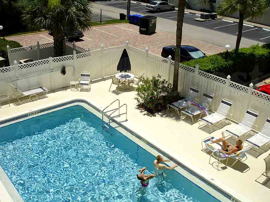 Neapolitan Club Community Pool and Sun Deck Furnishings